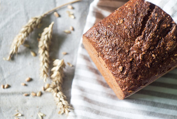 Fresh sourdough bread and ears of wheat