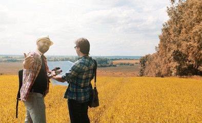 A young man looks at a map