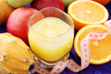 weight loss, diet concept: various fruits with glass of freshly squeezed juice