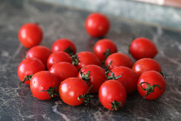 Fresh bright and juicy tomatoes on the kitchen