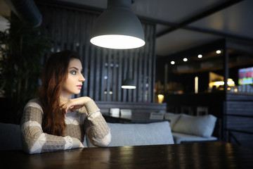 Beautiful girl in a cafe