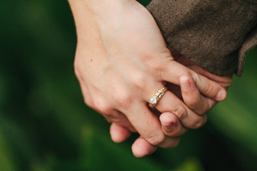 Engaged / Married Couple Holding Hands