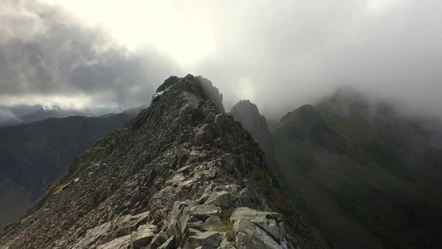 Rising clouds up the face of Crib Goch ridge in Snowdonia National Park, Wales, UK.