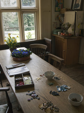 Vintage Hipster retro inspired Kitchen in England with buttons being counted on a table