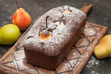 Cupcake with pears on a wooden board