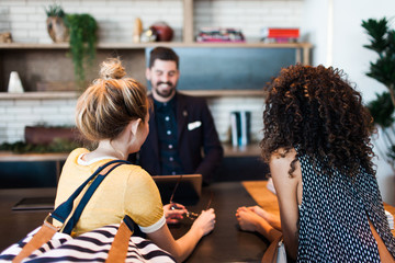 Young women checking into hotel