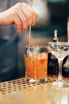 Bartending making a cocktail