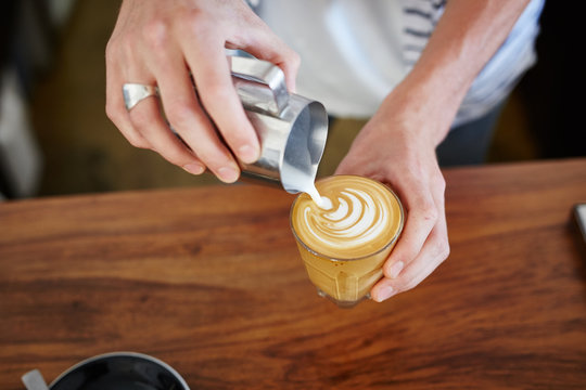 Barista making latte