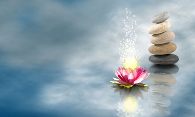 Obraz na płótnie Canvas lotus flower and stones on the water