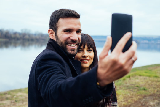 Caucasian Couple Talking Selfie in Nature