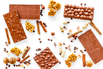 Chocolate bars on white background top view