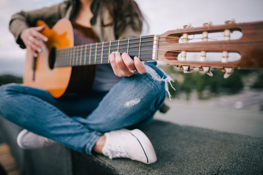 Acoustic guitar song. Live music on nature. Freedom, leisure, guitarist concert, unrecognizable young bard and composer concept