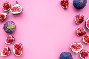 Fresh blue figs slices pattern on pink background top view copyspace