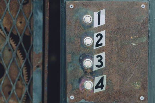 Rusty doorbells for four apartments.