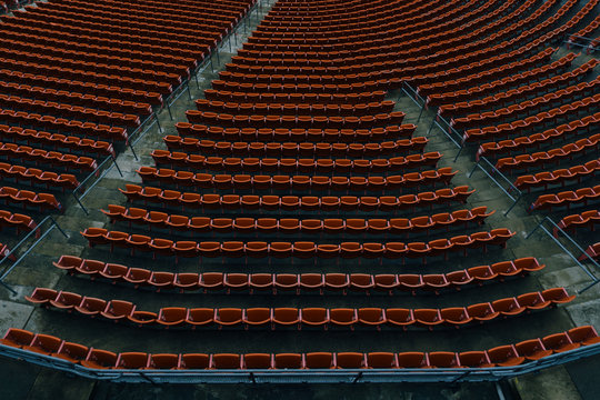 Looking down at empty seats of a stadium.