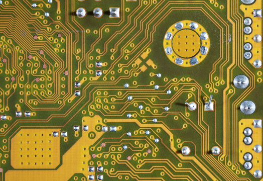 Gold circuit board background of computer motherboard