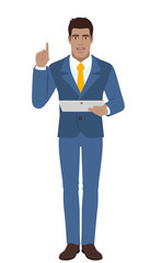 Businessman holding digital tablet PC and pointing up
