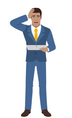 Shocked businessman holding digital tablet PC and grabbed his head
