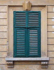 Old window with wooden blinds