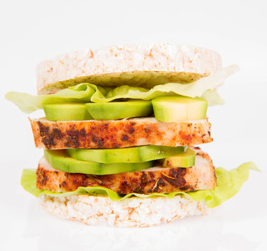 Rice waffles sandwich with chicken fillet  and avocado  