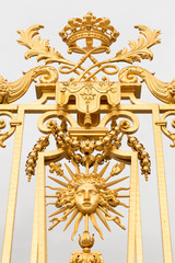 The golden gate of the Palace of Versailles, or Chateau de Versailles, or simply Versailles, in France