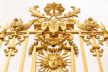 The golden gate of the Palace of Versailles, or Chateau de Versailles, or simply Versailles, in France