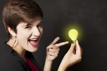 girl holding a light - idea concept
