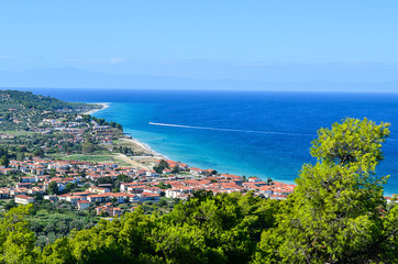 Fototapeta na wymiar Beautiful European town panorama. Threes, sea and beach is displayed in the background.