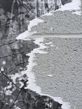 Close up of peeling posters on wall