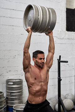 Man carrying a draft in a gym