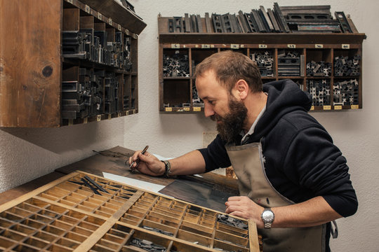 Man Working in an Old Printing House