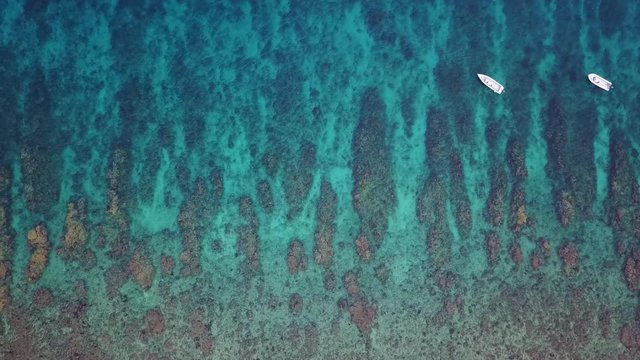 Aerial View of Coral Reef and Small Boats in Caribbean