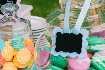 Details of a tasty candy bar with jugs of sweets, cookies and marshmallows, Candy, waffles, cookies...