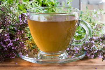 A cup of Breckland thyme tea on a wooden table