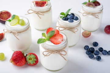 Fresh yogurt. Breakfast with yogurt with fruits and berries. Healthy food concept. Top view. Copy space