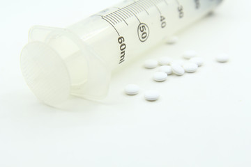 Syringe with drug on white background