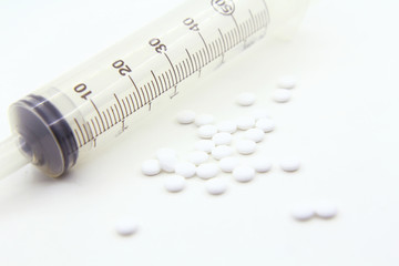 Syringe with drug on white background