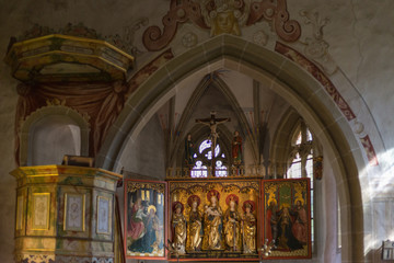 german catholic church with religious details around altar and architecture in september