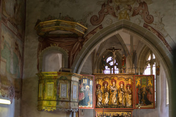 german catholic church with religious details around altar and architecture in september