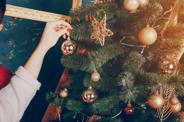 loving couple decorating Christmas tree