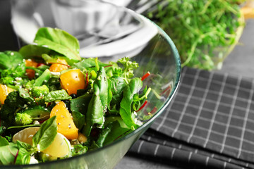Superfood salad in bowl on table