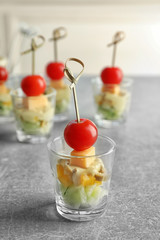 Delicious appetizer for baby shower on grey table