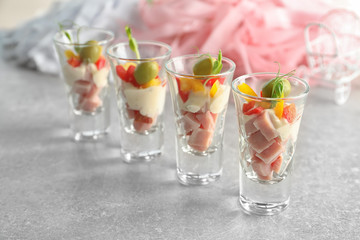 Delicious appetizers for baby shower on grey table