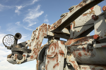 Scope and barrel on rusting WWII  gun mounted on Liberty Ship