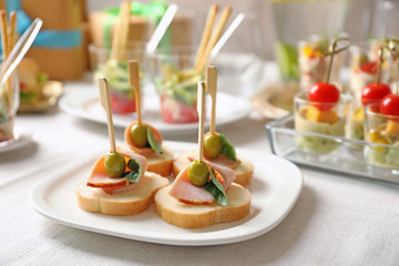 Delicious canapes for baby shower on plate