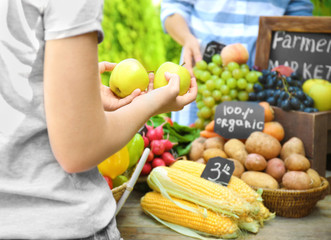 Woman buying products at farmer's market