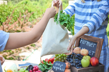 Woman buying products at farmer's market