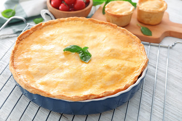 Delicious meat pie on baking grid