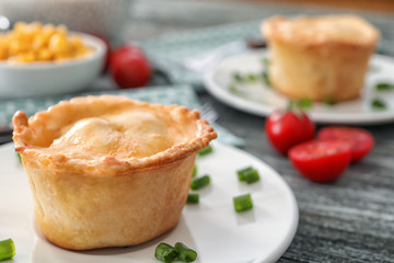 Delicious meat mini pie on plate, closeup