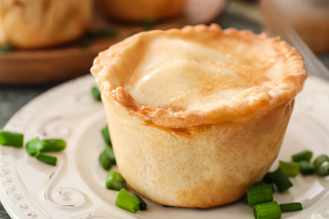 Delicious meat mini pie on plate, closeup